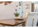 Close up of dining table with flower arrangement decor and wood finishes at 17 Juniper Dr, Davenport, FL 33837