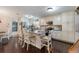 Bright, updated kitchen features white cabinets, a center island, and stainless steel appliances at 17 Juniper Dr, Davenport, FL 33837