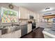 Modern kitchen boasts stainless steel appliances, granite counters, and an undermount stainless steel sink at 17 Juniper Dr, Davenport, FL 33837