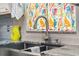 Kitchen sink with granite countertop, stainless steel faucet, and window with bird-themed curtains at 17 Juniper Dr, Davenport, FL 33837