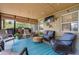 Covered porch with furnishings, including a grill, and a view of the outdoor scenery at 17 Juniper Dr, Davenport, FL 33837