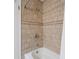 Tile shower featuring showerhead and convenient shower fixture at 17 Juniper Dr, Davenport, FL 33837