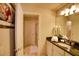 Well-lit bathroom featuring a walk-in shower, granite counters, and modern fixtures for a luxurious experience at 2147 Tripoli Ct, Kissimmee, FL 34747
