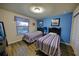 Bright bedroom with wood-look floors, two twin beds, and cheerful decor that creates a kid-friendly ambiance at 2147 Tripoli Ct, Kissimmee, FL 34747