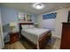 Well-lit bedroom featuring wood-look floors, a king bed, and stylish decor that creates a relaxing ambiance at 2147 Tripoli Ct, Kissimmee, FL 34747