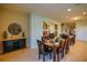 Formal dining room featuring a long table, seating for ten, and stylish decor at 2147 Tripoli Ct, Kissimmee, FL 34747