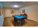 Recreation area featuring a pool table, wood floors, and neutral wall colors at 2147 Tripoli Ct, Kissimmee, FL 34747