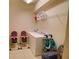 Functional laundry room with a washer and dryer, practical shelving, and seats ready for a Gathering at 2147 Tripoli Ct, Kissimmee, FL 34747