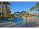 Community lazy river with clear water, lush landscaping, lounge chairs, and cabanas for relaxation at 2147 Tripoli Ct, Kissimmee, FL 34747