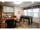 Entertainment area with table, foosball, wet bar, and natural light from the windows at 2147 Tripoli Ct, Kissimmee, FL 34747