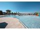 Inviting community pool area with shady pergola, splash park, and zero entry, perfect for Gathering fun and relaxation at 2147 Tripoli Ct, Kissimmee, FL 34747