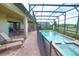Relaxing screened-in pool area with lounge chairs and a hot tub, perfect for outdoor entertainment at 2147 Tripoli Ct, Kissimmee, FL 34747