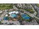 Beautiful aerial view of community with pool, tennis courts, and basketball court at 2322 Silver Palm Dr, Kissimmee, FL 34747
