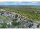 Breathtaking aerial view showing lush green spaces, nearby forest, and well-maintained landscaping in the community at 2322 Silver Palm Dr, Kissimmee, FL 34747