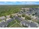 An aerial view showcases the community's lush landscaping, nearby parks, and tranquil residential atmosphere at 2322 Silver Palm Dr, Kissimmee, FL 34747