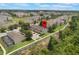 Aerial view of a multi-Gathering home in a verdant community near green spaces and landscaping at 2322 Silver Palm Dr, Kissimmee, FL 34747