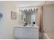 Bright bathroom with vanity, large mirror, vanity lighting, and a shower-tub combination at 2322 Silver Palm Dr, Kissimmee, FL 34747