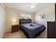 The bedroom includes a closet, ceiling fan, dresser, and nightstands for added convenience at 2322 Silver Palm Dr, Kissimmee, FL 34747
