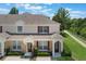 Charming townhome boasts a well-manicured lawn and inviting facade with brick accents at 2322 Silver Palm Dr, Kissimmee, FL 34747