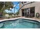 Enjoy the screened-in pool with ample seating, perfect for outdoor entertaining at 2322 Silver Palm Dr, Kissimmee, FL 34747