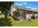 Screened-in pool and patio provide privacy and outdoor space for relaxation and leisure at 2322 Silver Palm Dr, Kissimmee, FL 34747