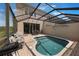 Enjoy the screened-in pool with outdoor grill and seating, perfect for entertaining at 2322 Silver Palm Dr, Kissimmee, FL 34747