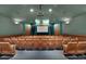 Enjoy movie nights in this theater room featuring comfortable seating and a large projection screen at 2322 Silver Palm Dr, Kissimmee, FL 34747