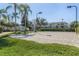 A community volleyball court featuring a sand surface, surrounded by well-maintained landscaping at 2322 Silver Palm Dr, Kissimmee, FL 34747