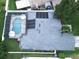 Aerial view of home with a screened in pool and solar panels on the roof at 2341 Stone Cross Cir, Orlando, FL 32828