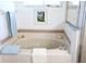 Bathroom features a soaking tub, shower, and framed artwork at 2341 Stone Cross Cir, Orlando, FL 32828