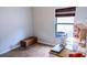 Bright bedroom with tile floors, a window, and a desk with sewing machine at 2341 Stone Cross Cir, Orlando, FL 32828