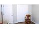 Spare bedroom featuring a small wicker chair and view of closet at 2341 Stone Cross Cir, Orlando, FL 32828