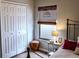 Bedroom with a closet, side table, and ample natural light at 2341 Stone Cross Cir, Orlando, FL 32828