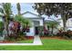 Charming single-story home featuring mature trees and vibrant landscaping at 2341 Stone Cross Cir, Orlando, FL 32828