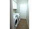 Efficient laundry room with a washer, dryer, and sink for convenience at 2341 Stone Cross Cir, Orlando, FL 32828