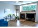 Inviting living room with a cozy fireplace and large window, creating a warm atmosphere at 2341 Stone Cross Cir, Orlando, FL 32828
