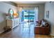 Bright living room with sliding glass doors leading to a pool area, filled with natural light at 2341 Stone Cross Cir, Orlando, FL 32828