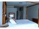 Main bedroom with four-poster bed, neutral decor, and ample natural light at 2341 Stone Cross Cir, Orlando, FL 32828