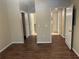 Spacious bedroom with multiple doorways and hardwood flooring at 239 Longview Ave # 107, Celebration, FL 34747