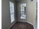 Inviting bonus room filled with light from large windows, complete with wood-look flooring at 239 Longview Ave # 107, Celebration, FL 34747