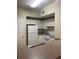 Well-maintained kitchen features white appliances and ample cabinet space at 239 Longview Ave # 107, Celebration, FL 34747