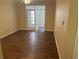 Bright living room featuring hardwood floors, ceiling fan, and French doors at 239 Longview Ave # 107, Celebration, FL 34747