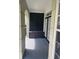 Inviting covered porch area with decorative shutters, a storage bench, and views of the well-maintained property at 239 Longview Ave # 107, Celebration, FL 34747