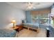Cozy bedroom featuring twin beds, natural light, and tasteful decor at 3015 Yellow Lantana Ln, Kissimmee, FL 34747
