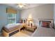 Charming bedroom with twin beds, soft lighting, and a serene atmosphere at 3015 Yellow Lantana Ln, Kissimmee, FL 34747