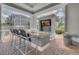 Outdoor kitchen with bar seating and a built-in television, perfect for entertaining friends and Gathering at 3015 Yellow Lantana Ln, Kissimmee, FL 34747
