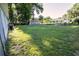 Large backyard with green grass, greenhouse and plenty of room for recreation at 3661 Se 131St Pl, Belleview, FL 34420