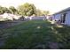 Expansive backyard with ample space for gardening and outdoor activities, enclosed by a wooden fence at 3661 Se 131St Pl, Belleview, FL 34420
