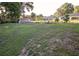 A large backyard featuring a mix of grassy areas and natural landscape, perfect for recreational use at 3661 Se 131St Pl, Belleview, FL 34420