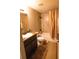 Bathroom features a tub and shower with tile surround, wood vanity, and neutral walls at 3661 Se 131St Pl, Belleview, FL 34420